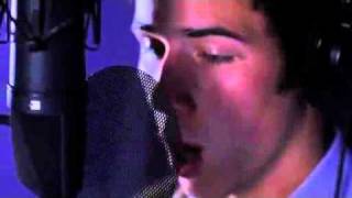 Nick Jonas singing Empty Chairs in a Studio