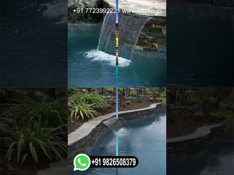 construire-piscine-enterrée-bordée-pierres-gazon