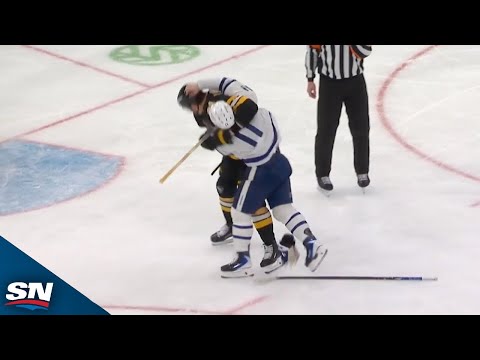 Mayhem breaks out as Max Domi drops gloves with Nikita Zadorov in front of Bruins' goal