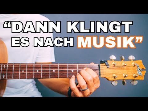 Melodie und Begleitung auf einer Gitarre spielen