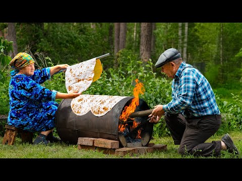 Traditional Lavash Bread: Baking Bread on a Barrel Over Wood Fire