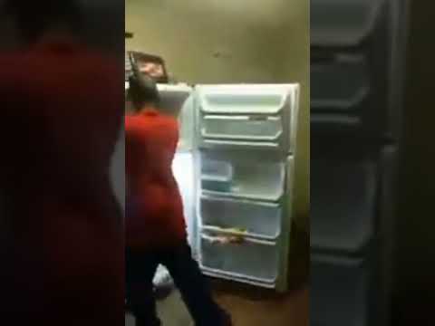 drunk guy tries to fight his fridge and loses