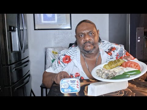 SARDINES mayonnaise and cracker plate with onions tomatoes and pickles