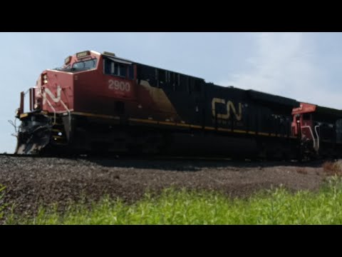 CN Intermodal train with a 100th anniversary unit in Oliver Wisconsin.