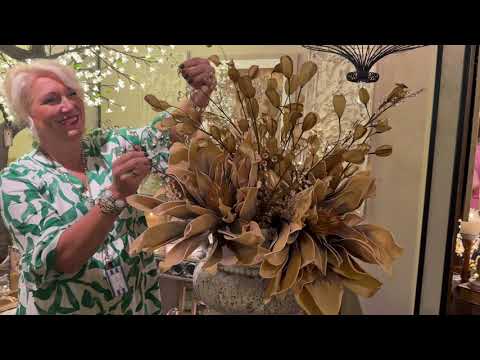 Lead designer Diane demonstrates layering permanent botanicals into a statement arrangement