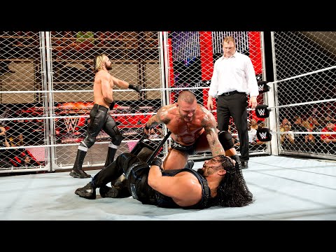 Randy Orton, Seth Rollins & Kane attack Roman Reigns inside a steel cage: Raw, Sept. 8, 2014