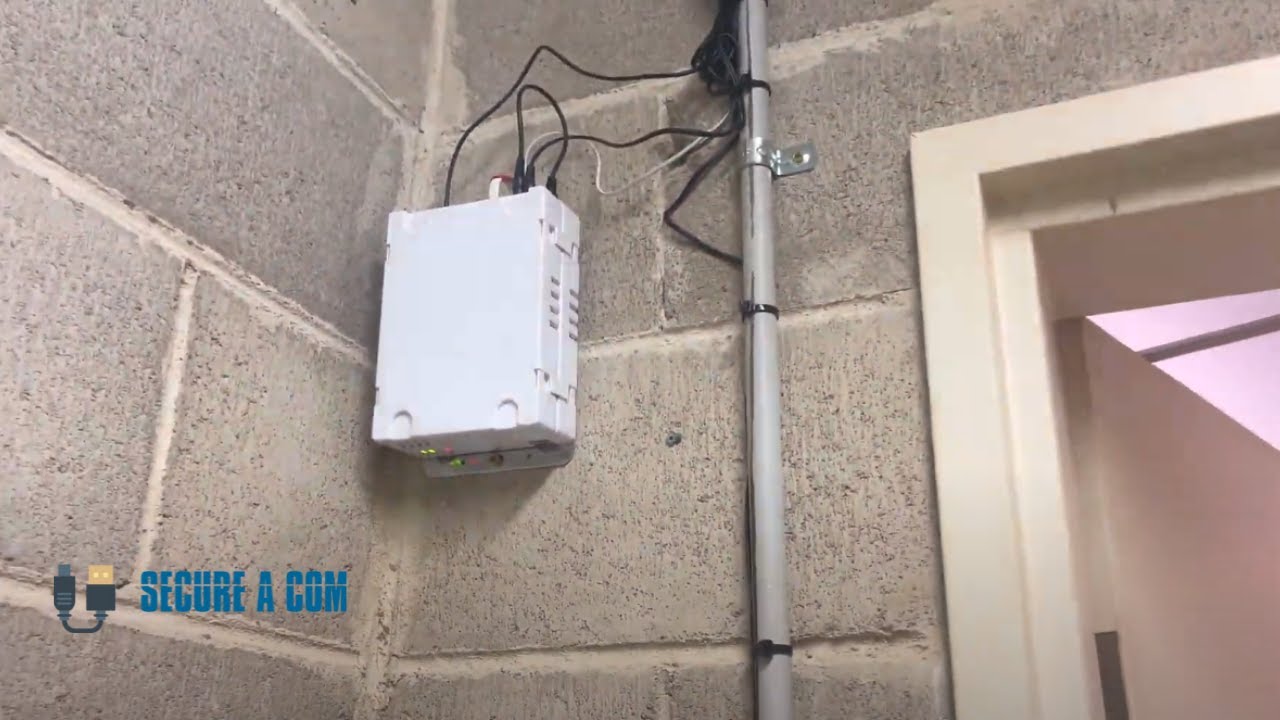 SECURE A COM technician upgrading a 3G GSM lift phone dialler to a 4G unit in Mosman, Sydney — compliance installation