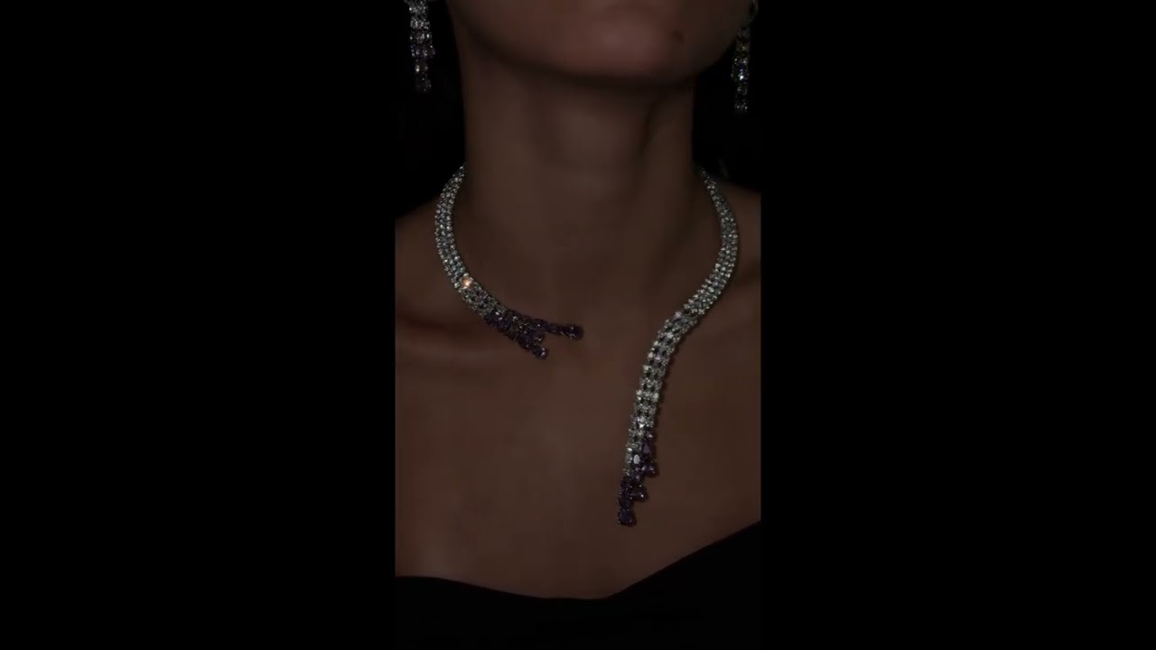 Modern accessory set with an open purple necklace