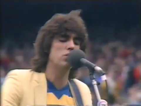 Mike Williamson introducing the 1981 VFL Grand Final with Jon English singing