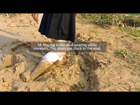 54.Playing in the mud wearing white sneakers. The shoes got stuck to the mud.