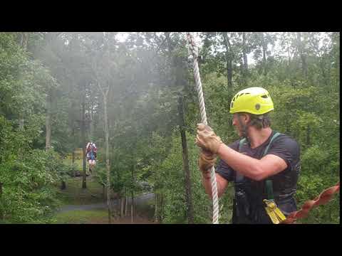 Sarah ziplining in the rain.