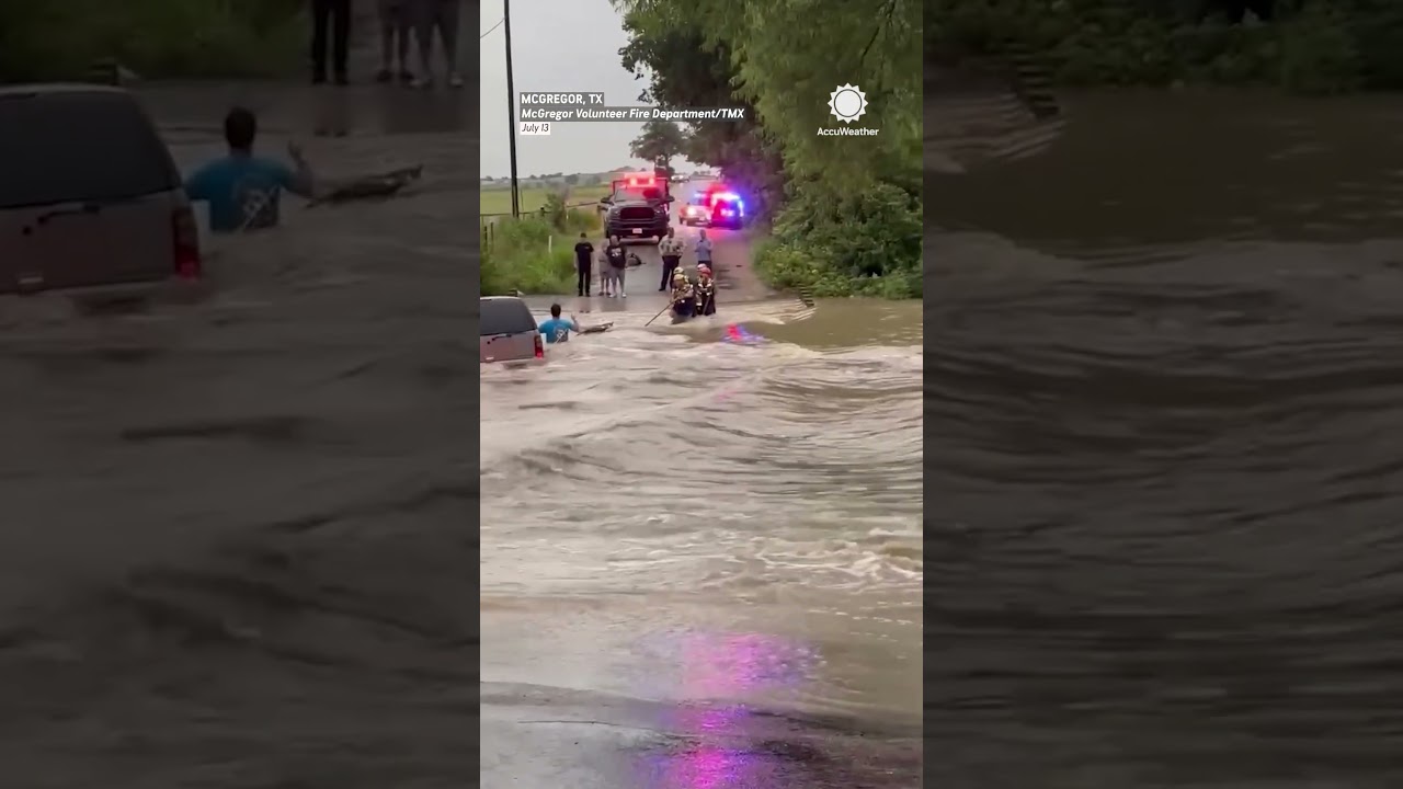 Texas Floods: Firefighters Rescue Person From Car On Flooded Road