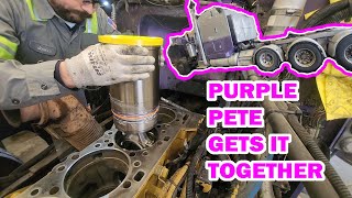 "Purple Pete" gets it together. C-15 with Aftermarket Cylinder head.
