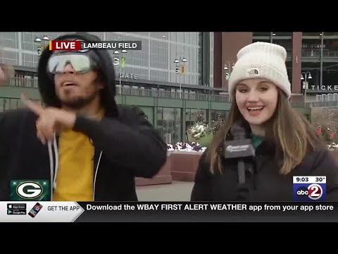Local Morning News Reporter Doesn't Realize Fan Crashing Her Report Is a Packers Player
