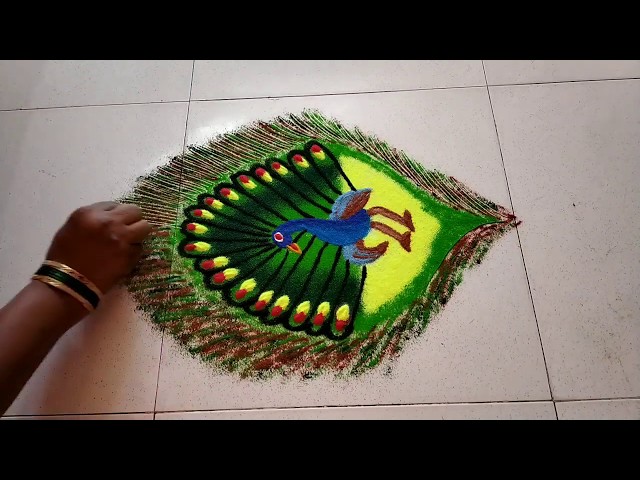 Beautiful peacock rangoli design by poonam bichkar - video 2