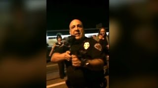 Officer resigns after pointing his rifle at Ferguson crowds