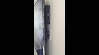 TV installed with cable box behind it. I-B-D INSTALLS BY DEREK