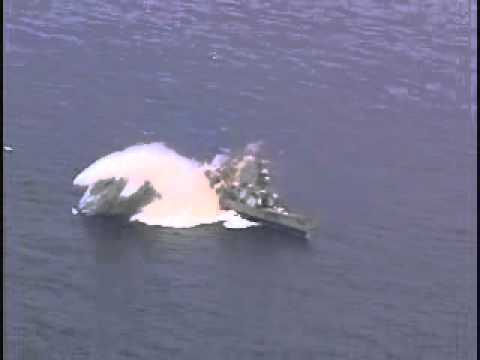 A torpedo hits a decomissioned U.S. Navy ship during RIMPAC