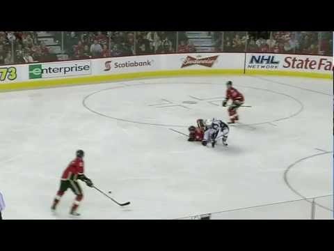 T.J. Galiardi hipchecks Blake Comeau