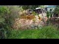 Best Bulldozer Action pushing stone soil into around the house across pond by Komatsu D20P & trucks