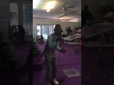 Young Man Sings Something About The Name Of Jesus.