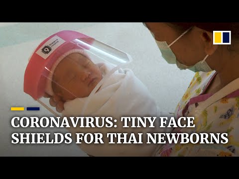 Newborn babies in Bangkok hospital are given tiny face shields to protect them from coronavirus