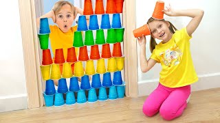 Kids play with colored cups and learn how to share