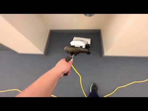 First floor hallway vacuuming with Olivia