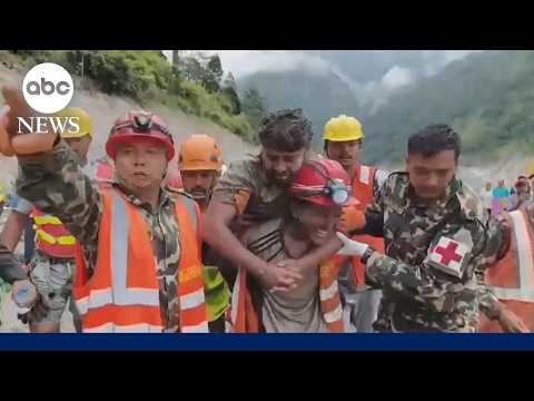 2 men found alive after being trapped for over a week by Nepal floods