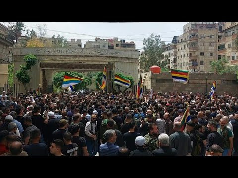 Syrian Druze chant during funeral for fighters killed in sectarian clashes | AFP