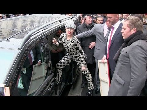 Lady Gaga greets her fans and give them flowers in Paris
