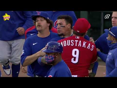Amir Garrett, Javier Baez have to be held back as Reds and Cubs benches clear