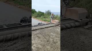 Concrete pavement single axis roller paving process