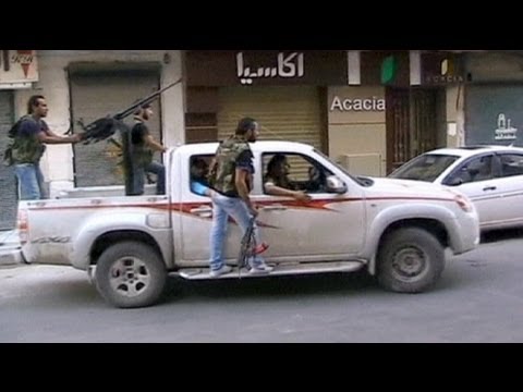 تقرير تلفزيوني حول مطالبة المجلس الوطني السوري بمناطق حظر جوي على الحدود...