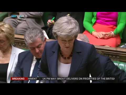 May defends Brexit deal amid cabinet resignations