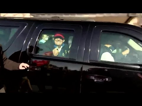 Trump thrills protesting supporters with motorcade drive-by