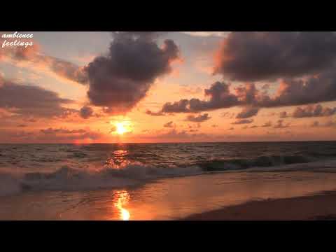 Orange sunset by the sea with calming natural sounds of the waves and music for relaxing