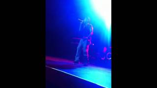J. Cole performing "Higher" at Club Nokia in LA .