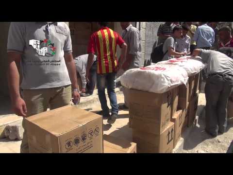 تقرير عن توزيع إغاثة في حي الشيخ مقصود من قبل مكتب الشؤون الاجتماعية والإغاثية في المجلس المحلي