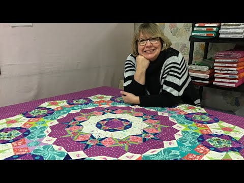 Tula Pink Tula Nova English Paper Piecing attaching the quilt to the background!