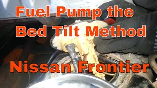 Nissan Frontier Fuel Pump replacement, bed tilt method part 1