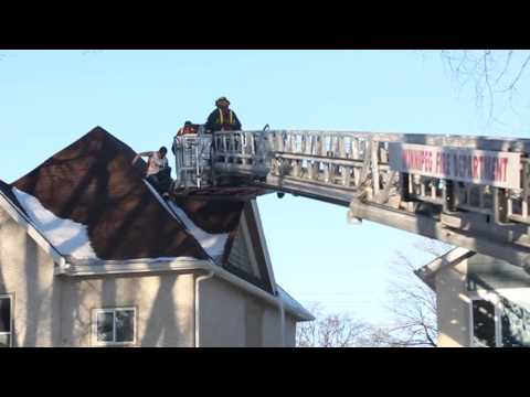 Man evades capture by climbing on roof