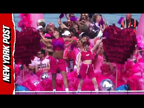 Thousands celebrate PRIDE in Amsterdam with colorful canal parade