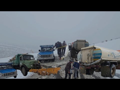 Between snow and blizzard; getting stuck in a snowstorm and unexpected rescue with water tankers!