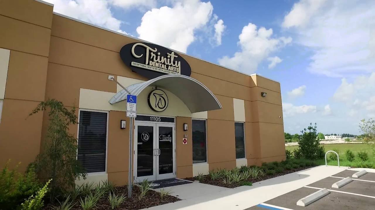Dr. Xhoana Gjelaj (DMD, MAGD, DABOI/ID, FAAID, DICOI) introduces her credentials and explains why advanced board certification matters for implant patients at Trinity Dental Arts.