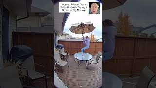 Woman Tries to Close Patio Umbrella During a Storm — Big Mistake