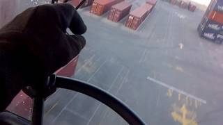 Operating a Straddle carrier at work.