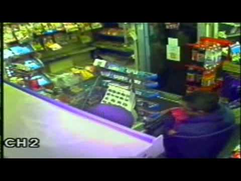 Police hunt robbers who threatened shopkeeper and young daughter with gun and meat cleaver