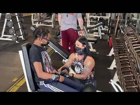 Nicole working with Mali on biceps