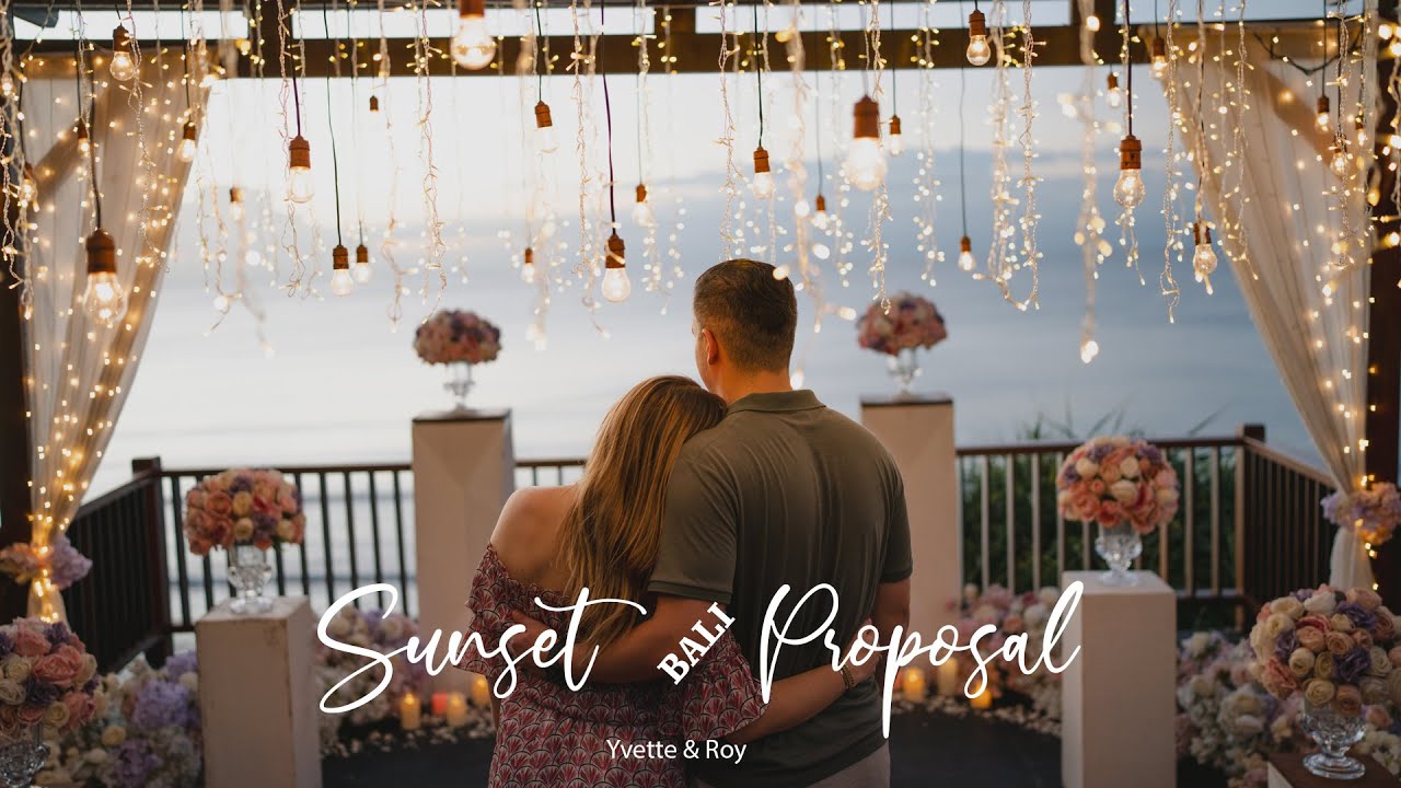 Video thumbnail: Yvette and Roy, couple under fairy lights at a sunset proposal